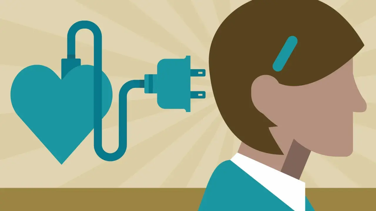Un cœur bleu relié par un câble à une prise électrique près de la tête d'une personne. Un test HPE pour l'énergie vitale.