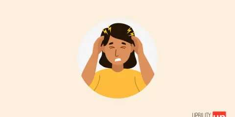 Une personne se tient la tête, le visage crispé, symbolisant un cerveau hypersensible et une amygdale suractive.