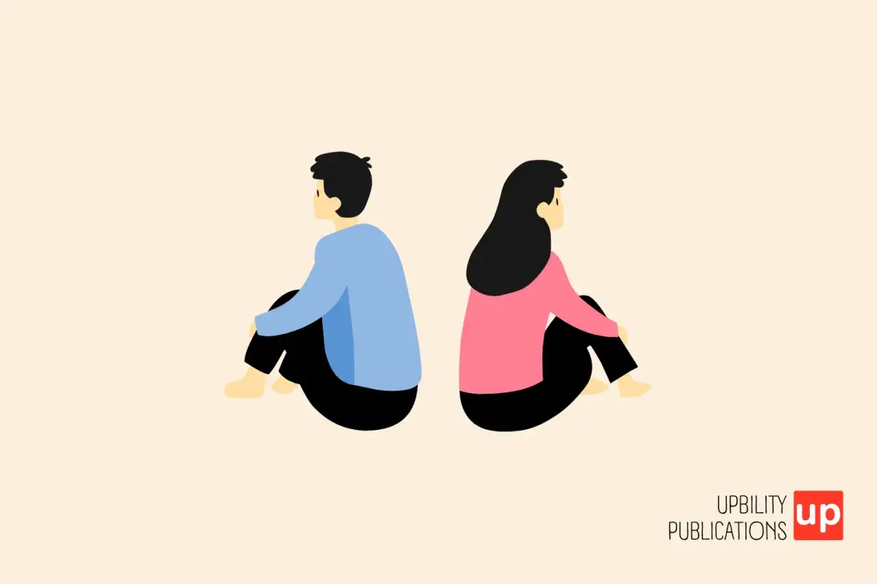Un homme et une femme assis dos &agrave; dos, symbolisant la solitude et la recherche de comment combler un manque affectif.